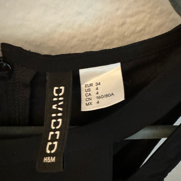 Maxi black dress with cut out parts and see thru top layer - Picture 4 of 4